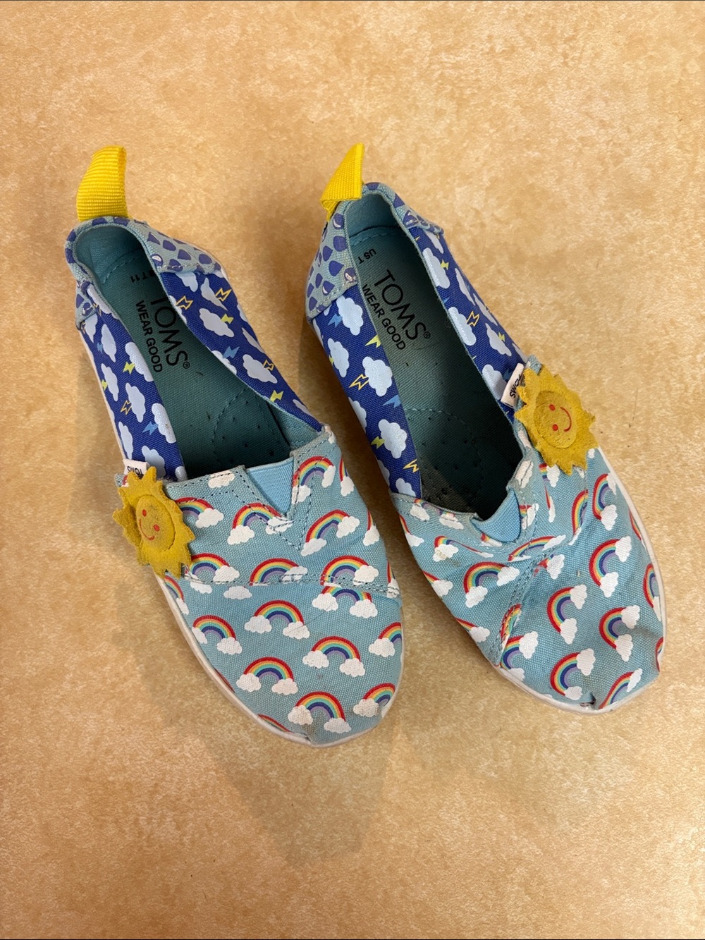 TOMS Kids Blue Rainbow Slip-On Sneakers with Yellow Sun Applique